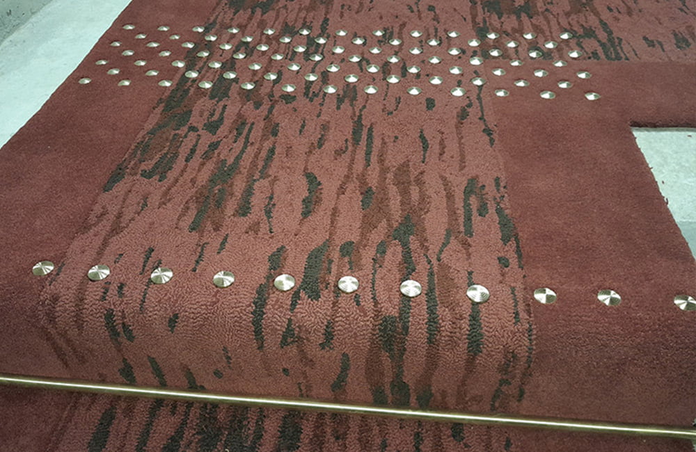 RiveRom voorbeeld podotactiele noppen tapijt